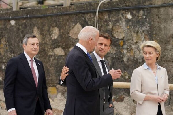 French President Emmanuel Macron slaps his face while visiting the city